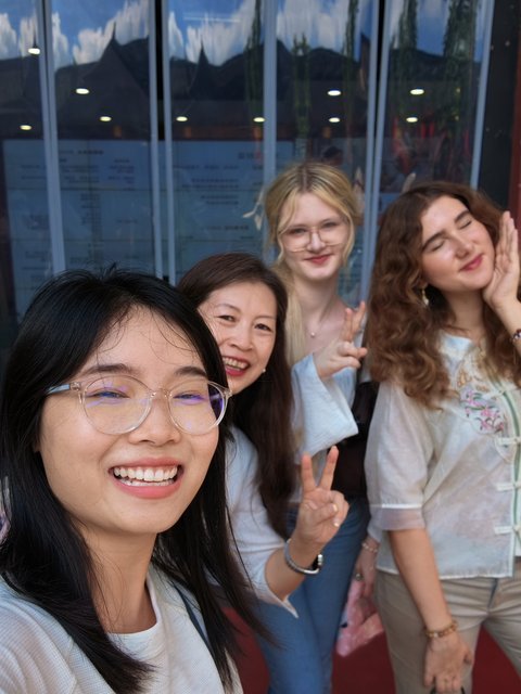 Travelers taking a group selfie